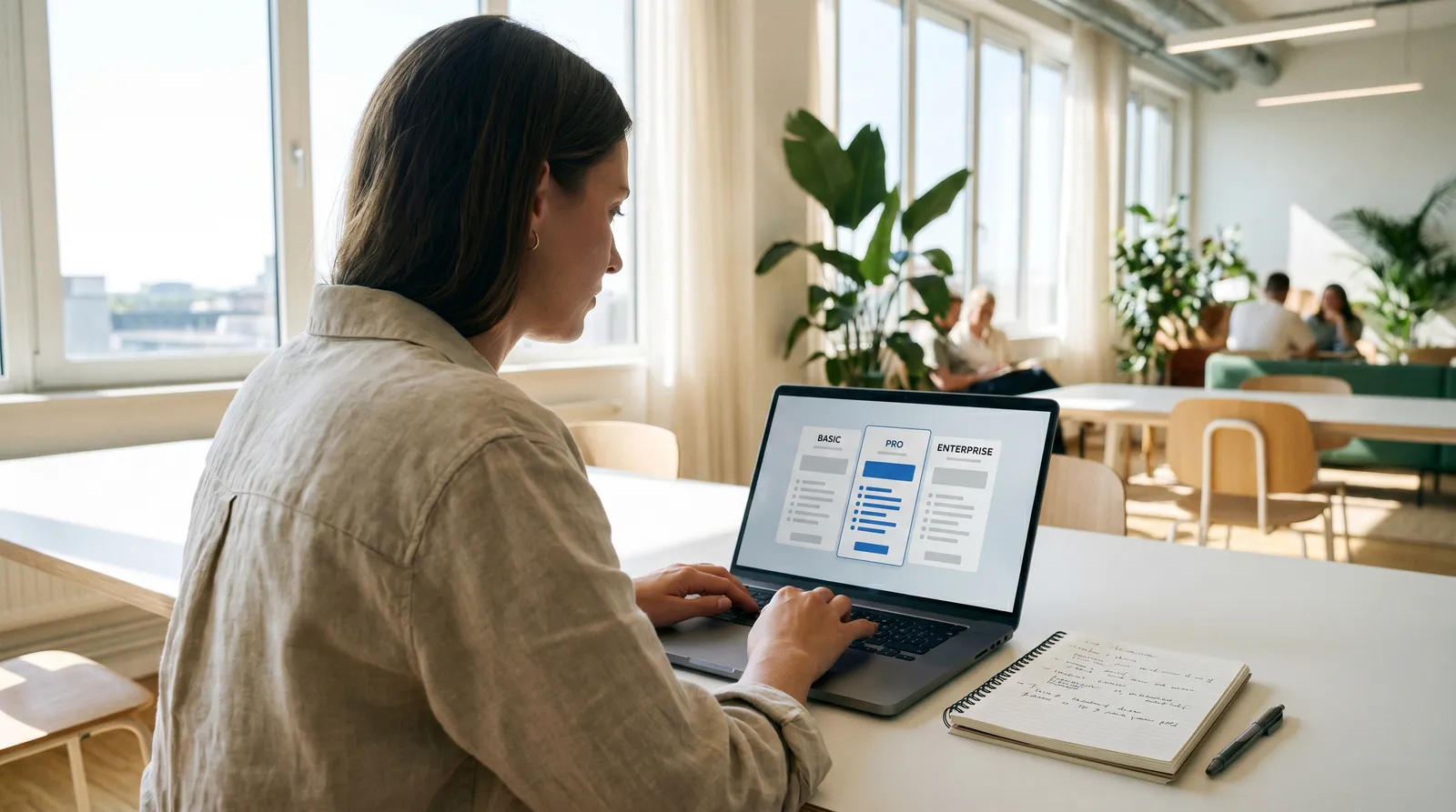 A person at a clean modern desk reading software documentation on a laptop, conveying a beginner learning what GHL SaaS Mode is for the first time.